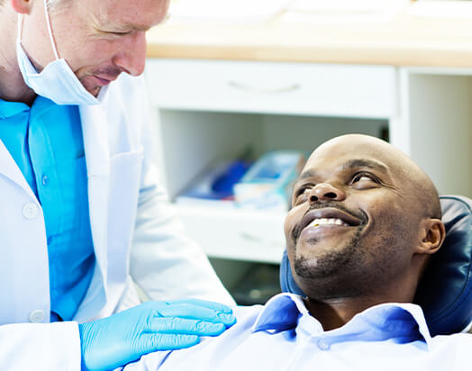 man speaking with his dentist